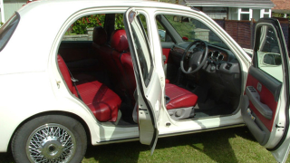 Illustration for article titled Miniature Nissan modified to look like vintage Jaguar on Ebay